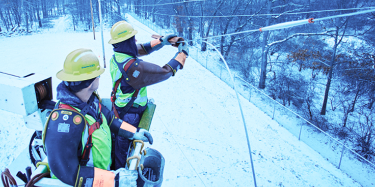 two men repairing powerline